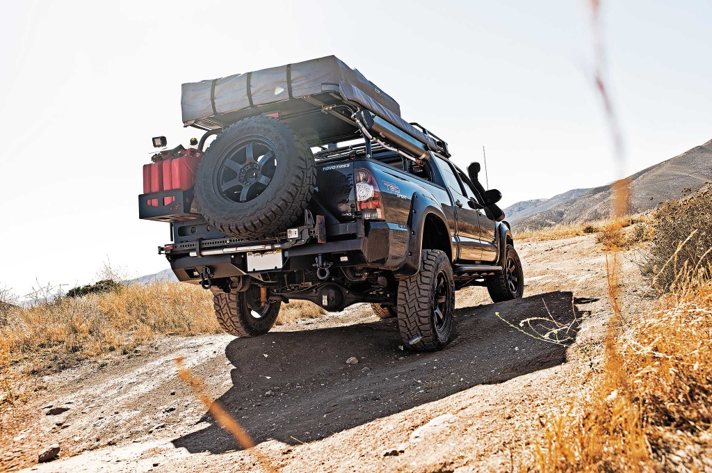 A CBI Off-Road Trail Rider 2.0 bumper with swing-away tire carrier protects the rear end. Tucked below the spare tire in the rear is a Hi-Lift X-TREME Jack which can be used not only for jacking the truck up to swap out a flat tire, but also for manual winching and clamping.
