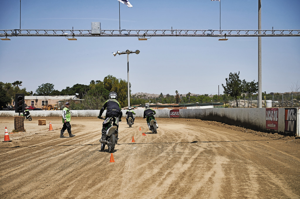 Riders practice slaloming while standinag during a class hosted by Kawasaki and the Motorcycle Safety Foundation. 