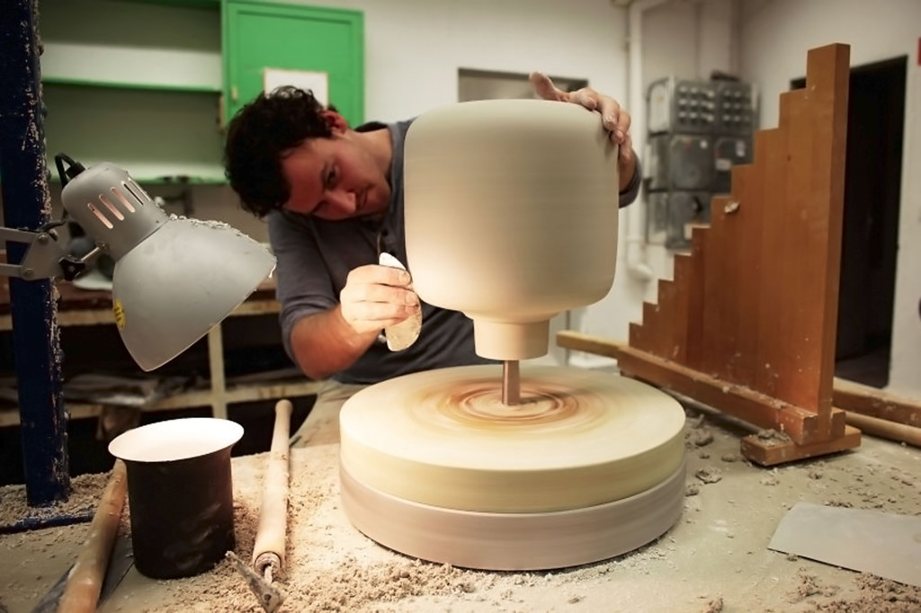 The clay mold is hand-sculpted and helps the lamp take shape.