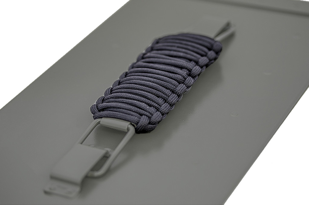 The can's handle is wrapped with paracord for comfort, added grip, and quick access to cordage.