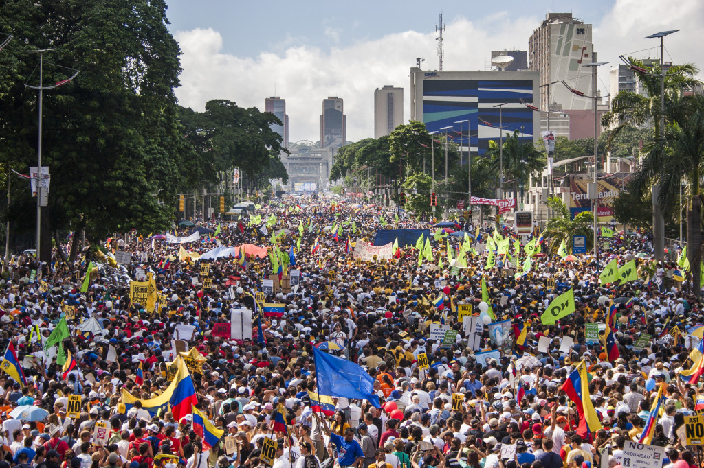 Demonstrators march against constitutional amendments made by president Hugo Chavez, including the declaration of Venezuela as a socialist state.
