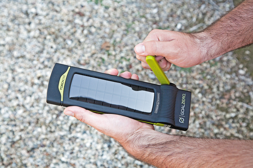 On one side of the Torch, there's a bright green hand crank, which is held in place by a small magnet. Pivoting this handle out and turning it charges the device's battery.