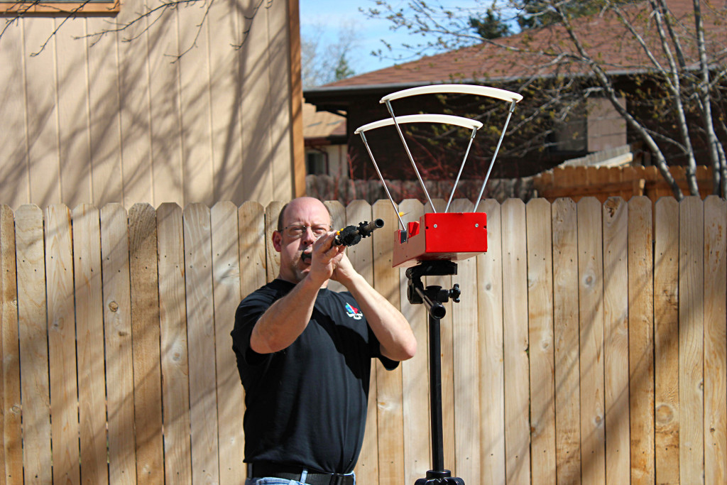 The author chronographing a .40-caliber blowgun. Note that the dart has just exited the muzzle. Blowguns can typically achieve muzzle velocities of 150 to 200 fps.