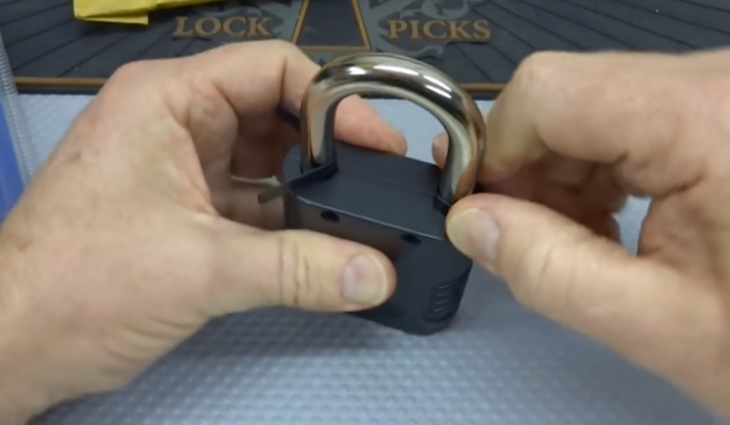 Two commercially-available metal shims can easily open this combination lock.