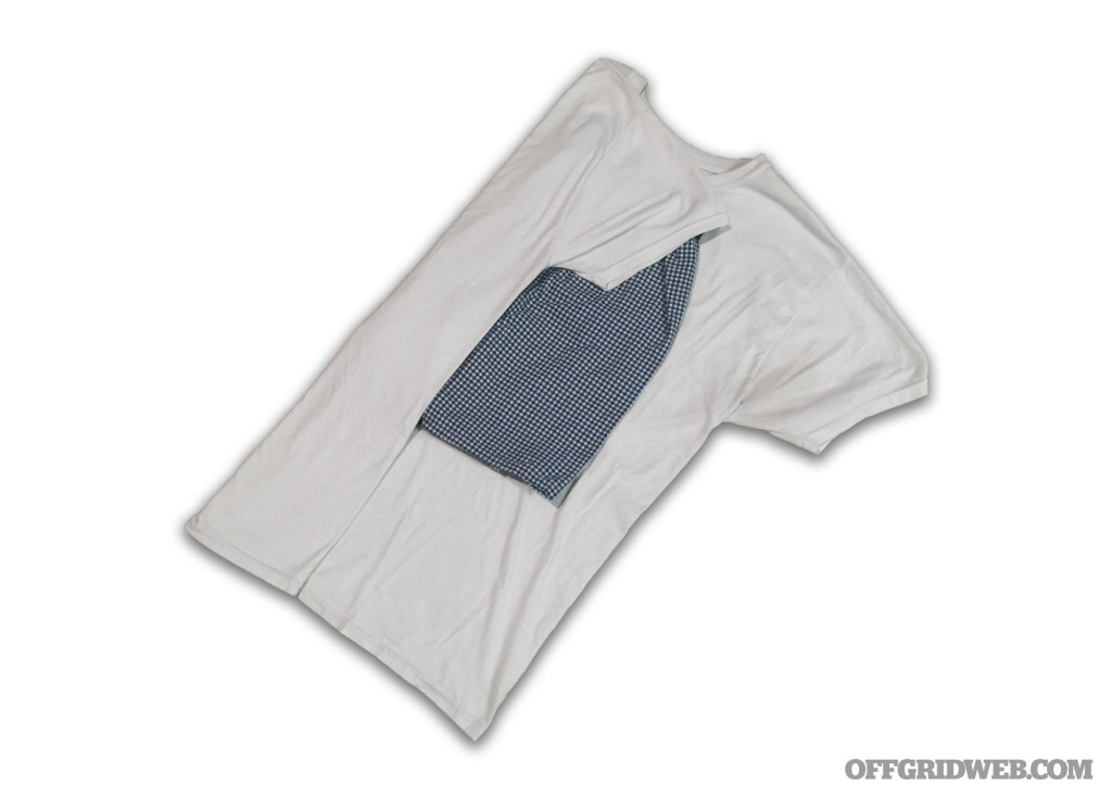 Fold the edges of the shirt over the center. Fold carefully to avoid wrinkles.