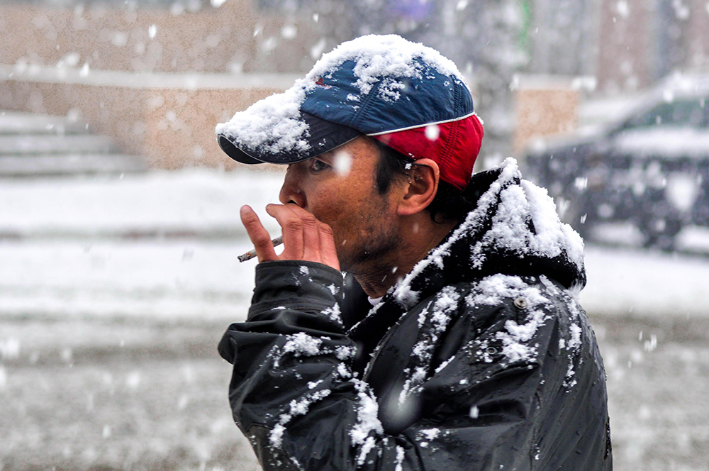 Frostbite snow cold winter man smoking cigarette 12